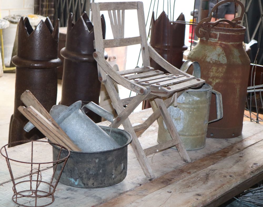 A milk churn, watering can, childs chair, etc.